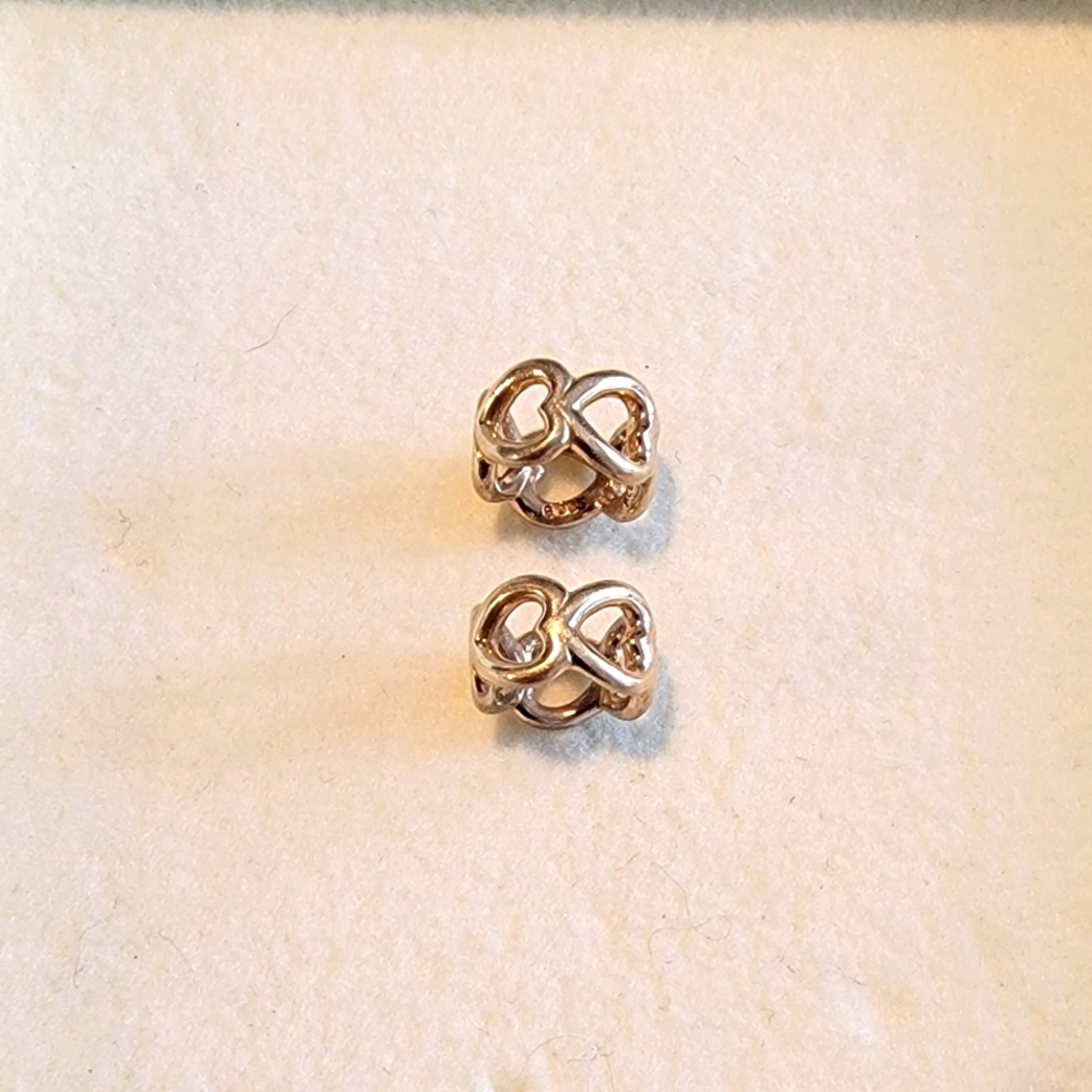 Pandora 14 carat Gold heart spacers (quantity of 2). Retired. Great condition.